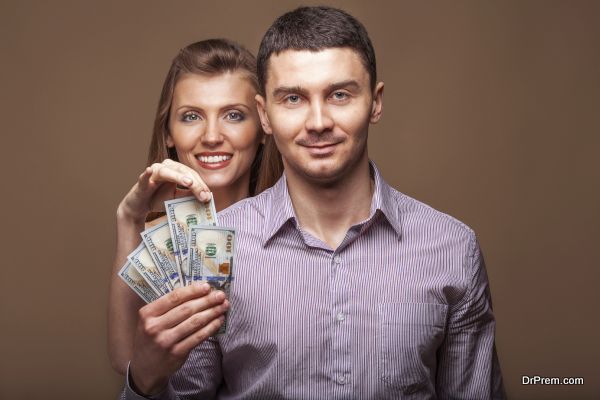 Fashion beautiful couple in love holding money