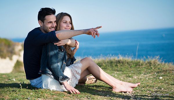 happy young couple on vacation by the sea