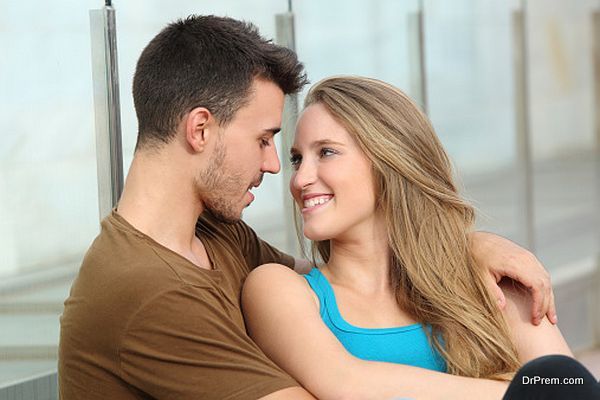 Couple in love looking each other outdoor