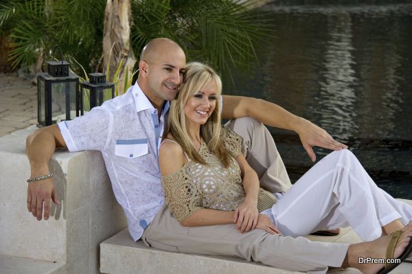 Couple lounging by the pool