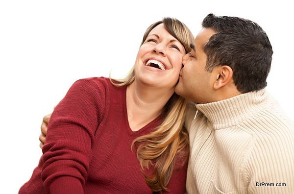 Attractive Mixed Race Couple Kissing on White