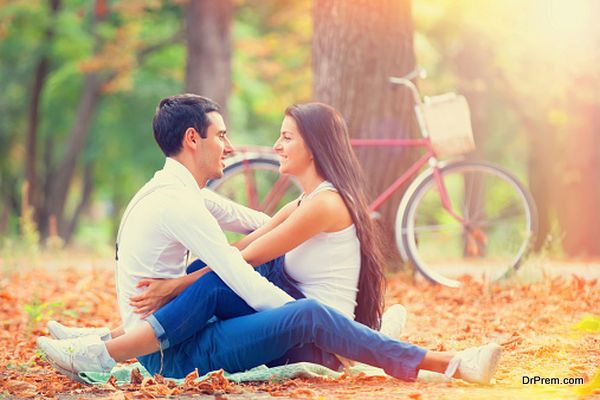 couple with retro bike in the park