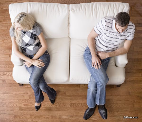 Young Couple Sitting on Love Seat