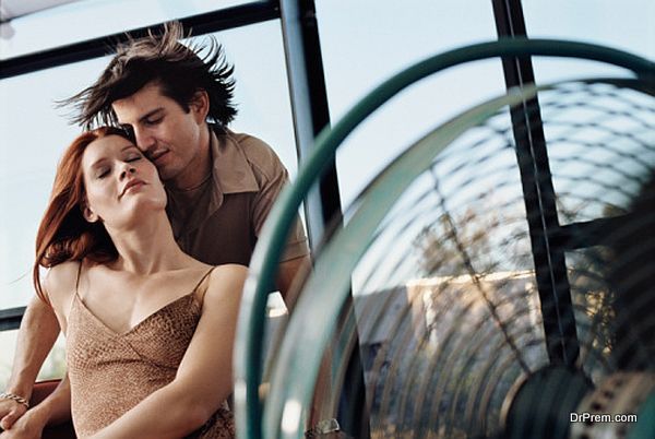 Couple relaxing in front fan