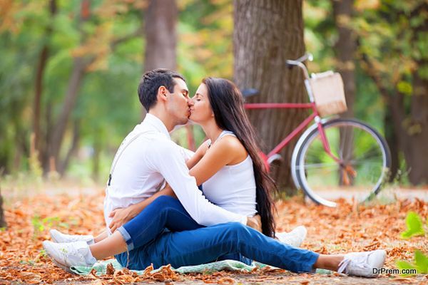 couple with retro bike in the park