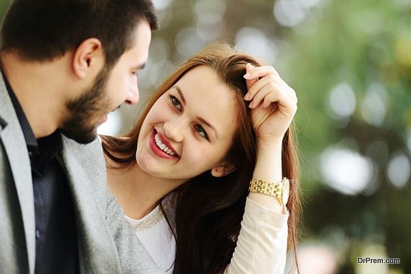 Lovely couple enjoying fall in love at park