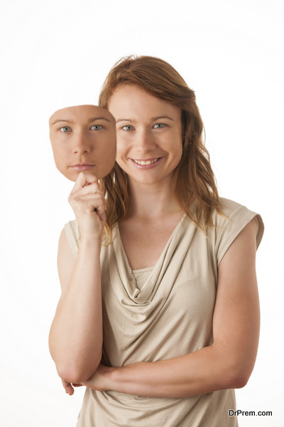 Woman hiding under the happy mask.