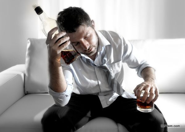 drunk business man wasted and whiskey bottle in alcoholism