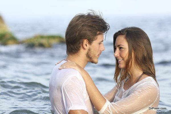 Young couple in love bathing in the sea