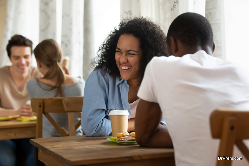 Happy young mixed race girl attending speed dating